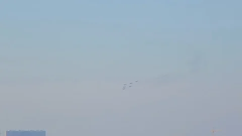 Group of military fighters flies over the city Stock Footage 97989341
