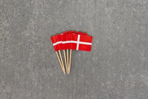 Group of Miniature Denmark Flags on Toothpicks Over Grey Background 库存照片