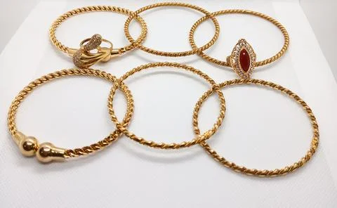 A Group of Mix Bangles and Ring isolated White Background Foto stock