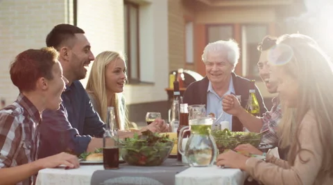 Group of Mixed Race People Having fun, Communicating and Eating  Stock Footage
