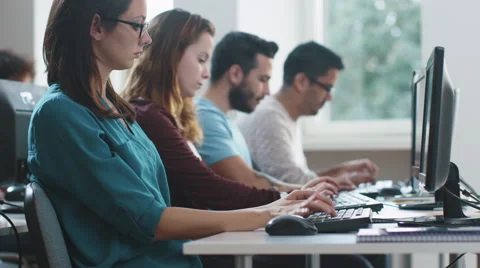 Group of Mixed Race Students are sitting in a Row and Working on Computers. Vidéo 67202777
