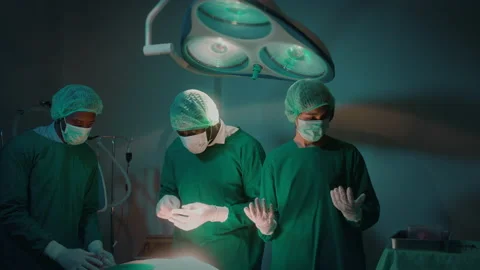 Group of mixed-races professional surgeons operating in hospital operating ro 스톡 동영상 195207938