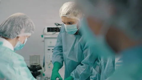 Group of mixed-races professional surgeons performing heart transplant surgery Stock-Footage 272828127