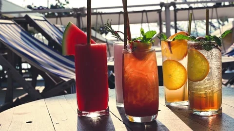 Group of mocktail drinks on the table at the poolside of summertime on holiday. Video stock 149465063