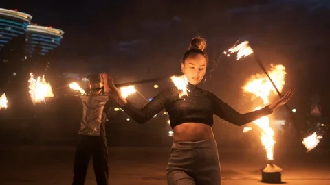 Group of modern fireshow artists performs spectacular flame tricks outdoor, on Stock Footage 120688319