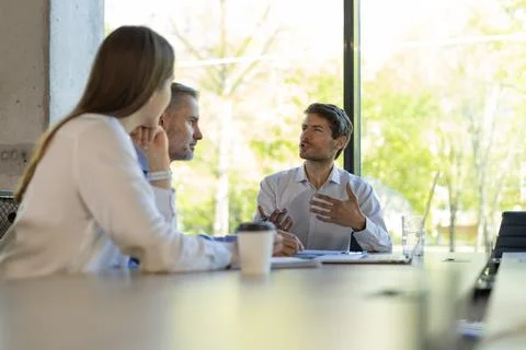 Group of modern people using modern technologies while working in the creativ Stock Photos