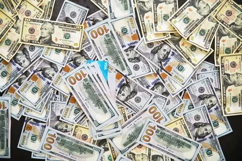 Group of money stack of 100 US dollars banknotes a lot of the background te.. Foto stock