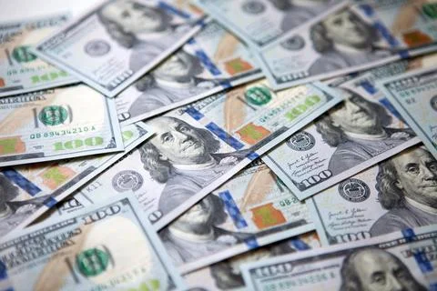 Group of money stack of one hundred US dollars banknotes a lot of the backg.. Stock Photos
