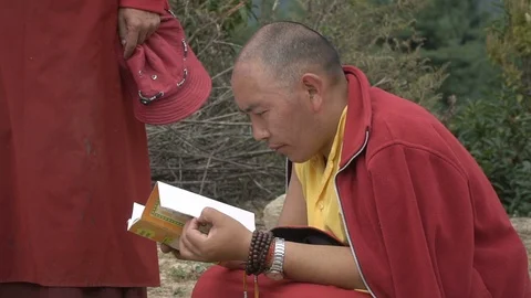 A group of monks resting Stock Footage 87113493
