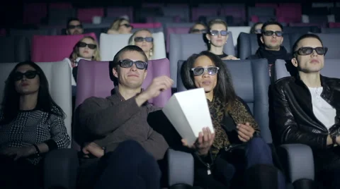 Group of multi-ethnic people in 3D glasses is watching a film at cinema Stock Footage 58133564