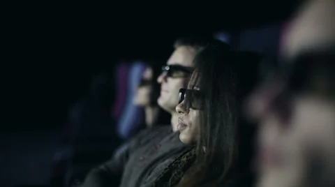 Group of multi-ethnic people in 3D glasses is watching a film at cinema Stock Footage 58133916