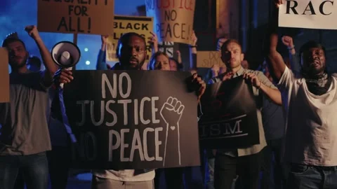 Group of multi-ethnic protests striking for human rights at night demonstration Video stock 133283865