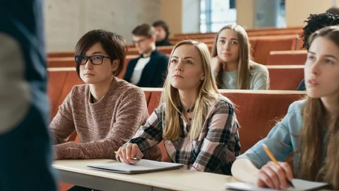 Group of Multi Ethnic Students in Classroom Taking Exam/ Test.  Stock Footage