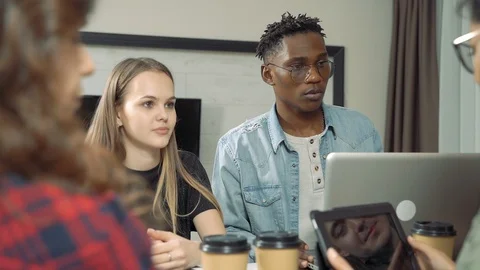 Group of multi-ethnic students or colleagues working together Stock Footage 122730779