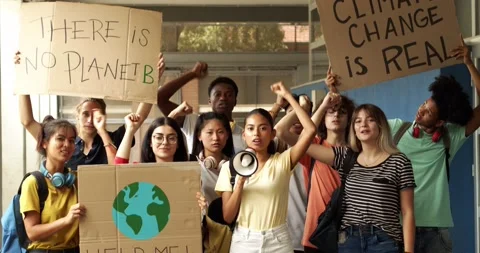 Group of multi-ethnic teenagers protesting against climate change. No planet b Stock Footage 157316437