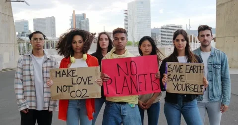 Group of multi-ethnic teenagers protesting against climate change. No planet b Stock Footage 221703701