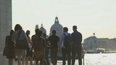 Group of multi-ethnic tourists walking in Venice, view of Grand Canal, tourism 스톡 동영상 75987610