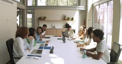 Group of multi-ethnic workers working as a team in an office or coworking space Stock Footage 157878094