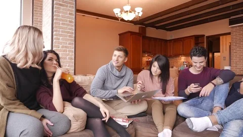 Group of multi ethnic young students having fun to preparing for exams in home Stock Footage 70805204