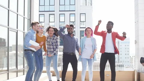 Group of multi ethnic youngsters chilling in urban outdoor background Stock Footage 91892852