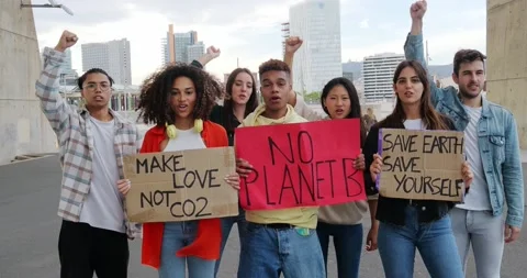 Group of multi-ethnic youth protests with posters in defense of the Earth Stock Footage 230284893