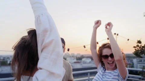 Group of multi ethnicity friends dancing at the party in top of the roof Stock Footage 203998546