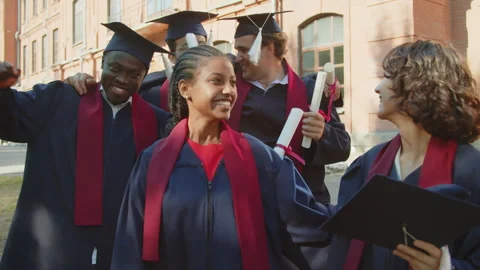 Group of Multicultural Excited Students with Diplomas after Graduation Ceremony Stock Footage 256703760