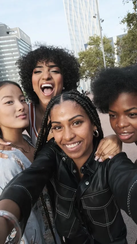 Group of multicultural friends and a trans woman smiling while taking selfie Stock Footage 221907554