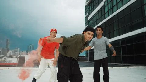 Group of multicultural hipster playing color flare at rooftop. Endeavor. 写真素材