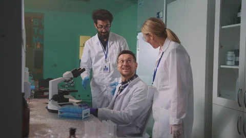 Group of multicultural people working in laboratory. Happy lab workers Video stock 250978946