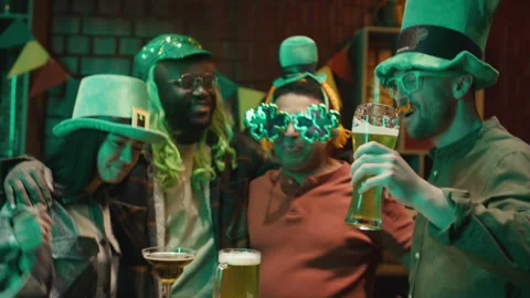 Group of Multiethnic Friends Having St Patricks Day Party in Bar Stock Footage 261497438