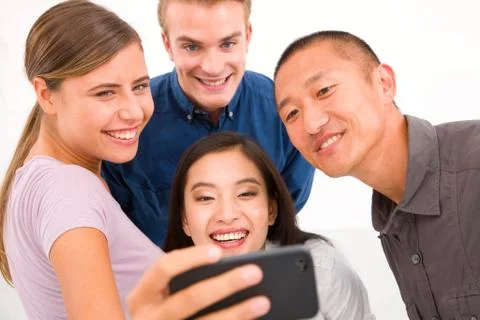 Group of multiethnic friends taking self portrait Stock Photos