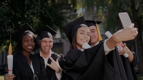 A group of multiethnic graduate students making selfie and taking pictures on Stock Footage 116181822