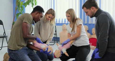 Group of multiethnic people during the first aid training with instructor Stock Footage 163977471