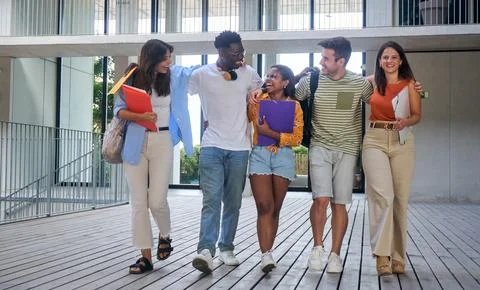 Group of multinational young students walking together in a high school Stock Photos