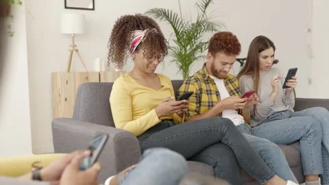 Group of multiracial addicted friends using mobile phone together Stock Footage 190025907
