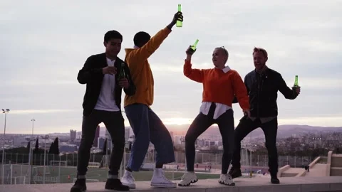 Group of multiracial friends dancing excitedly outdoors on spring day Stock Footage 237111712