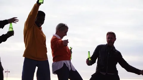 Group of multiracial friends dancing excitedly outdoors on spring day Stock Footage 245485785