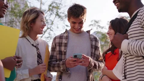 Group of multiracial generation z young smile happily watching funny videos on a Stock Footage 260577135