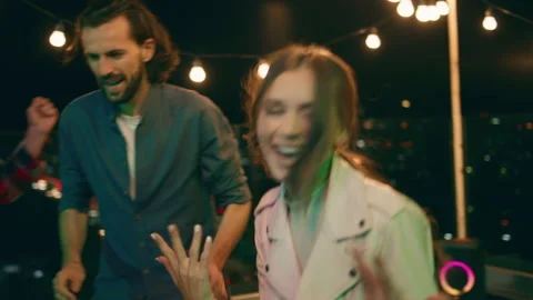 Group of multiracial people have a fun time together at the party drinking Stock Footage 159610752