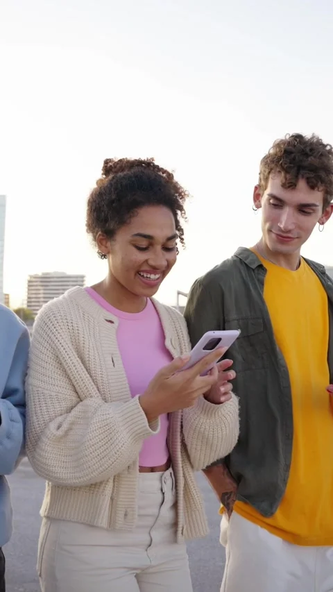 A group of multiracial young people walking using mobile cell Stock Footage 272835178