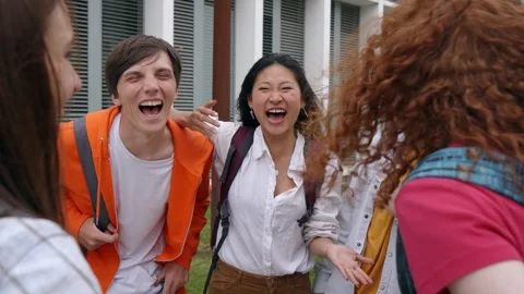 Group of multiracial young students having fun standing together on college Stock Footage 241260360