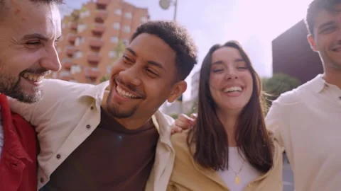 Group of multirracial people smiling at camera outside. Cheerful community of Stock Footage 266608627