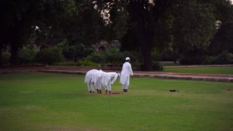 A group of Muslim man praying in the park outdoor: New Delhi, India - 10 11 2023 Video stock 262610201