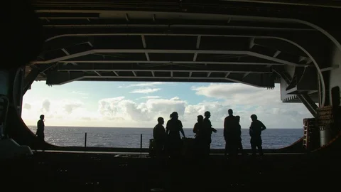 Group of Navy officers standing inside the USS Carl Vinson Stock Footage