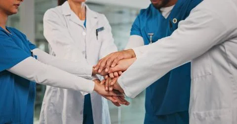 Group, nurses and doctors with handstack in hospital for celebration, surge.. Stock Photos