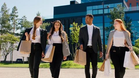 Group of office workers and managers multi racial after work walking down the Stock Photos