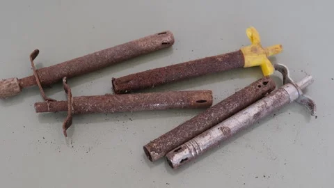 Group of old rusty gas lighters on gray background Видео 330658060
