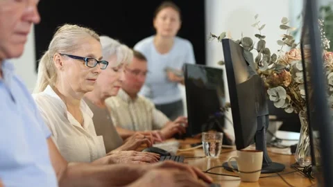Group of older people studying on computer course Stock Footage 342126823