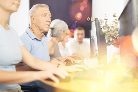 Group of older people studying on computer course Stock Photos